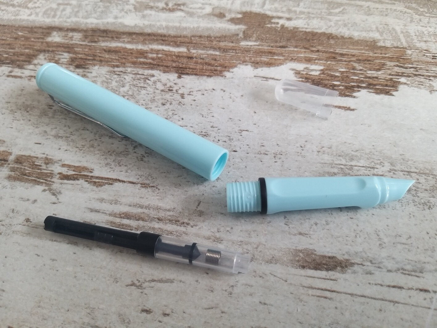 Pastel fountain pen with push button