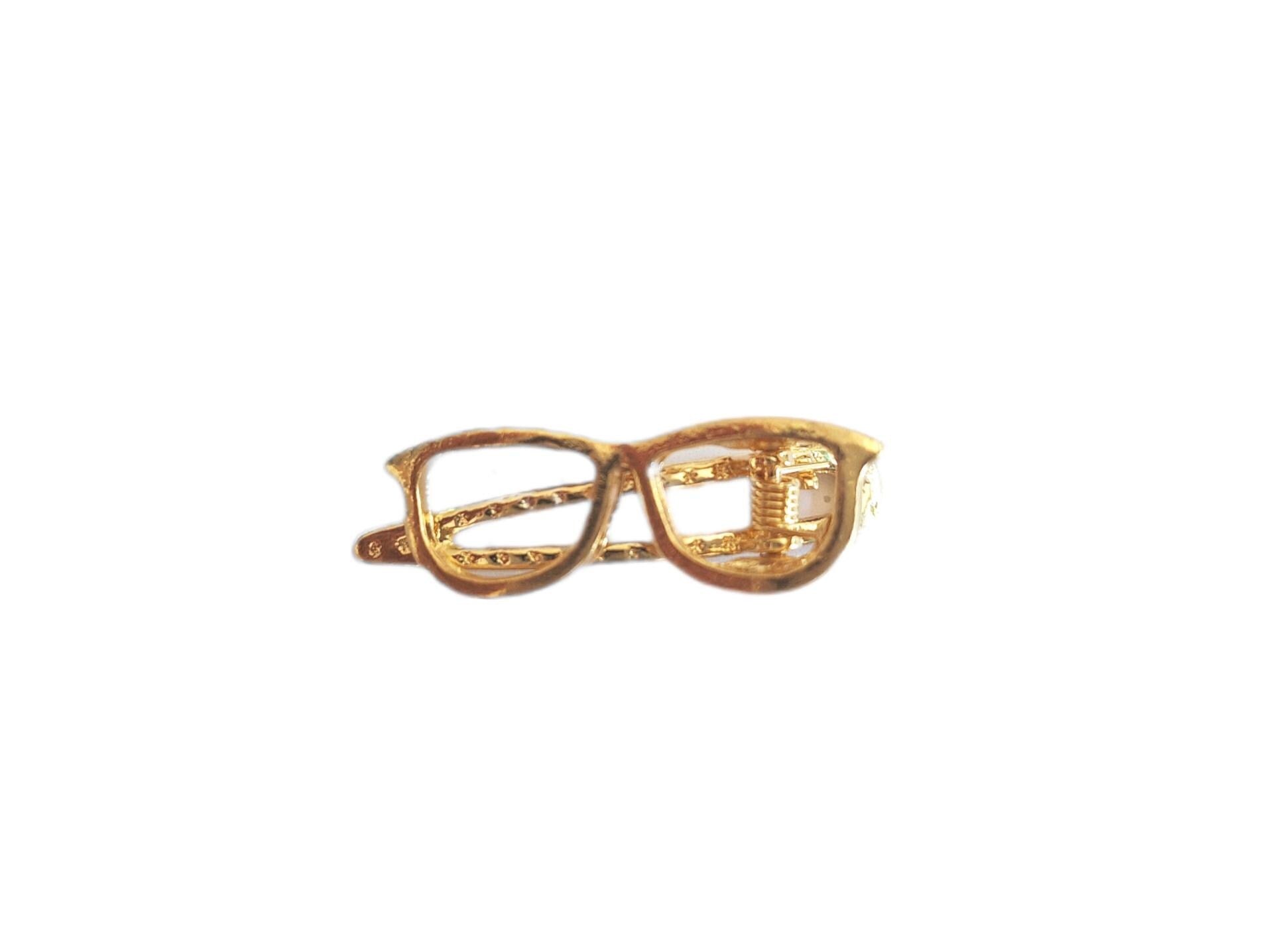 Pinces pour stylos plume et lunettes de soleil